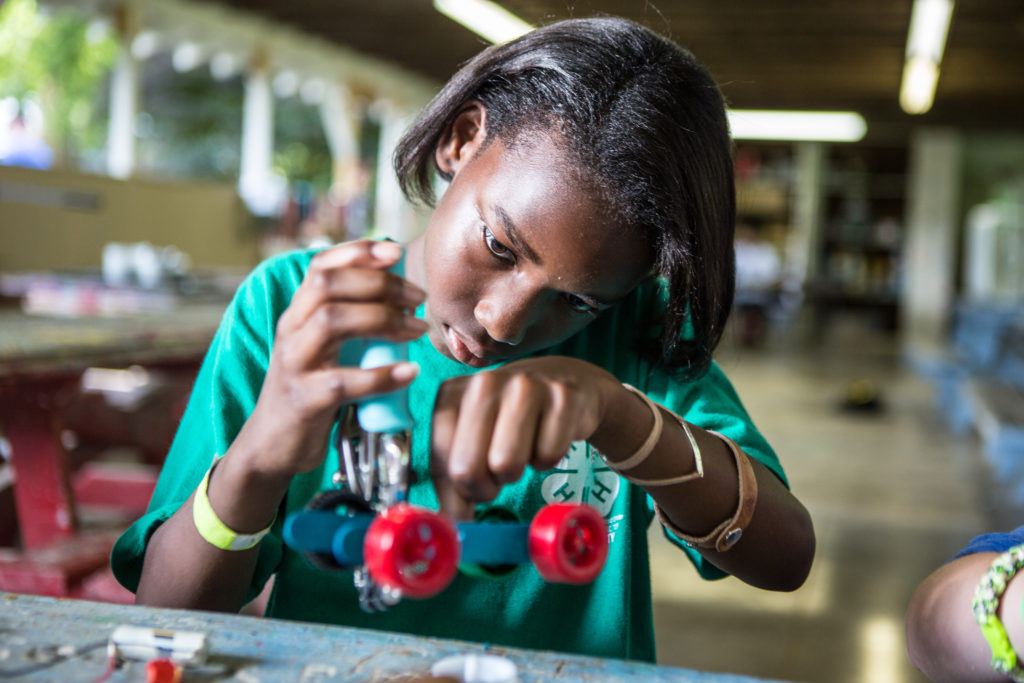 Young girl working on a science project