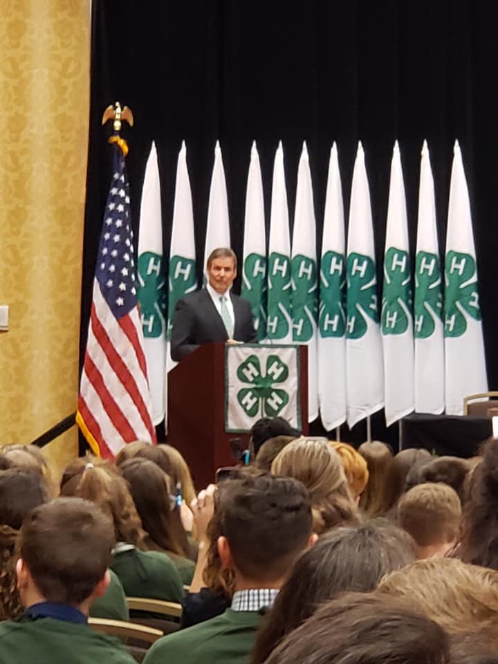 State 4-H Congress meeting with a man on stage