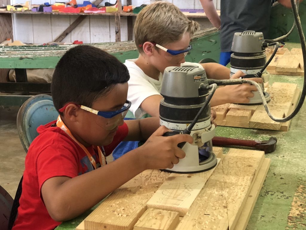 two boys doing a wood shop project 