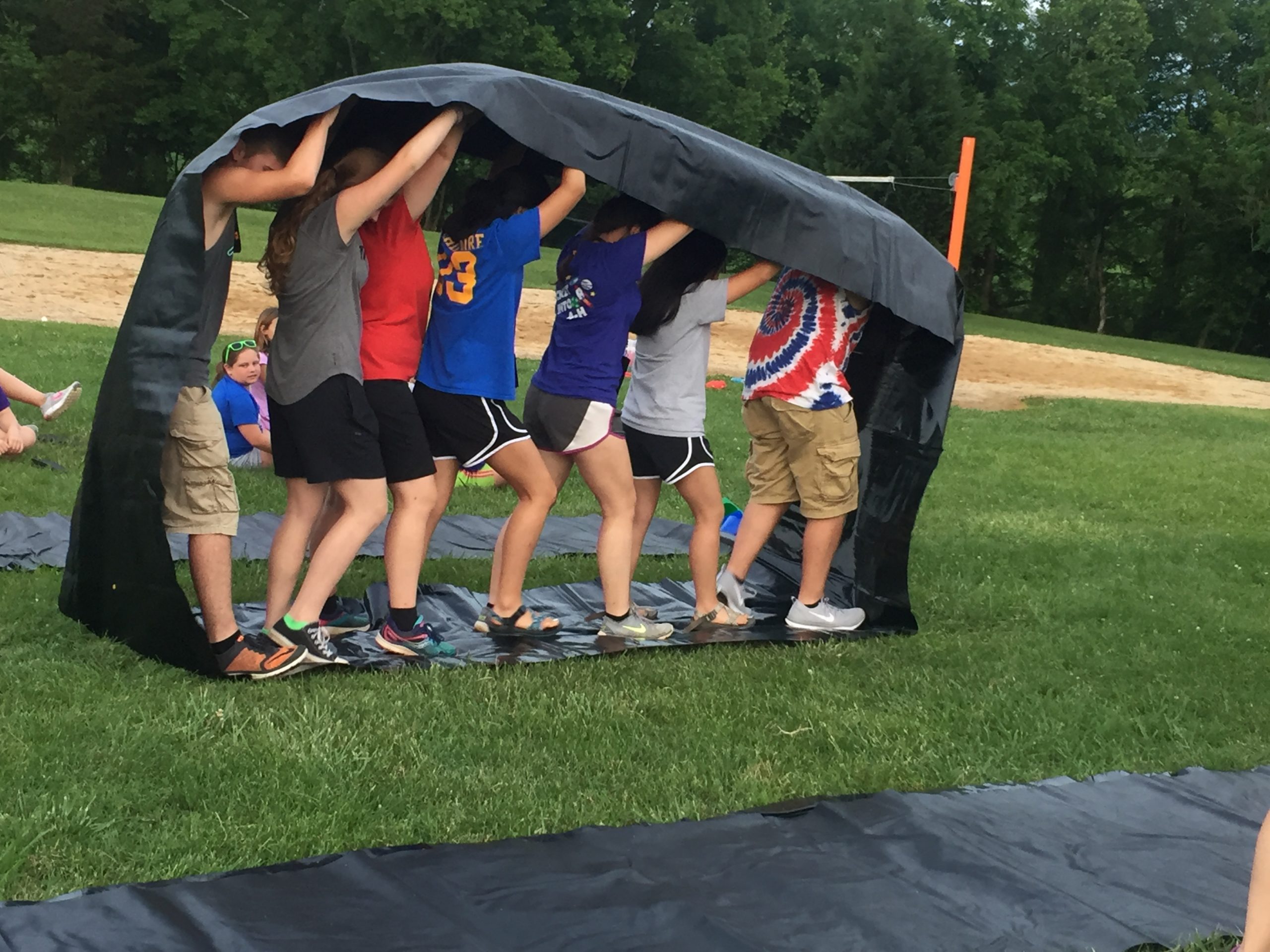 Group of youth playing a game at a 4-H camp