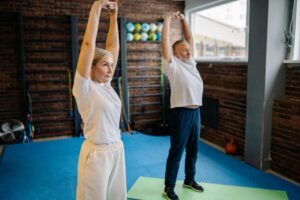 Two people stretching before exercising